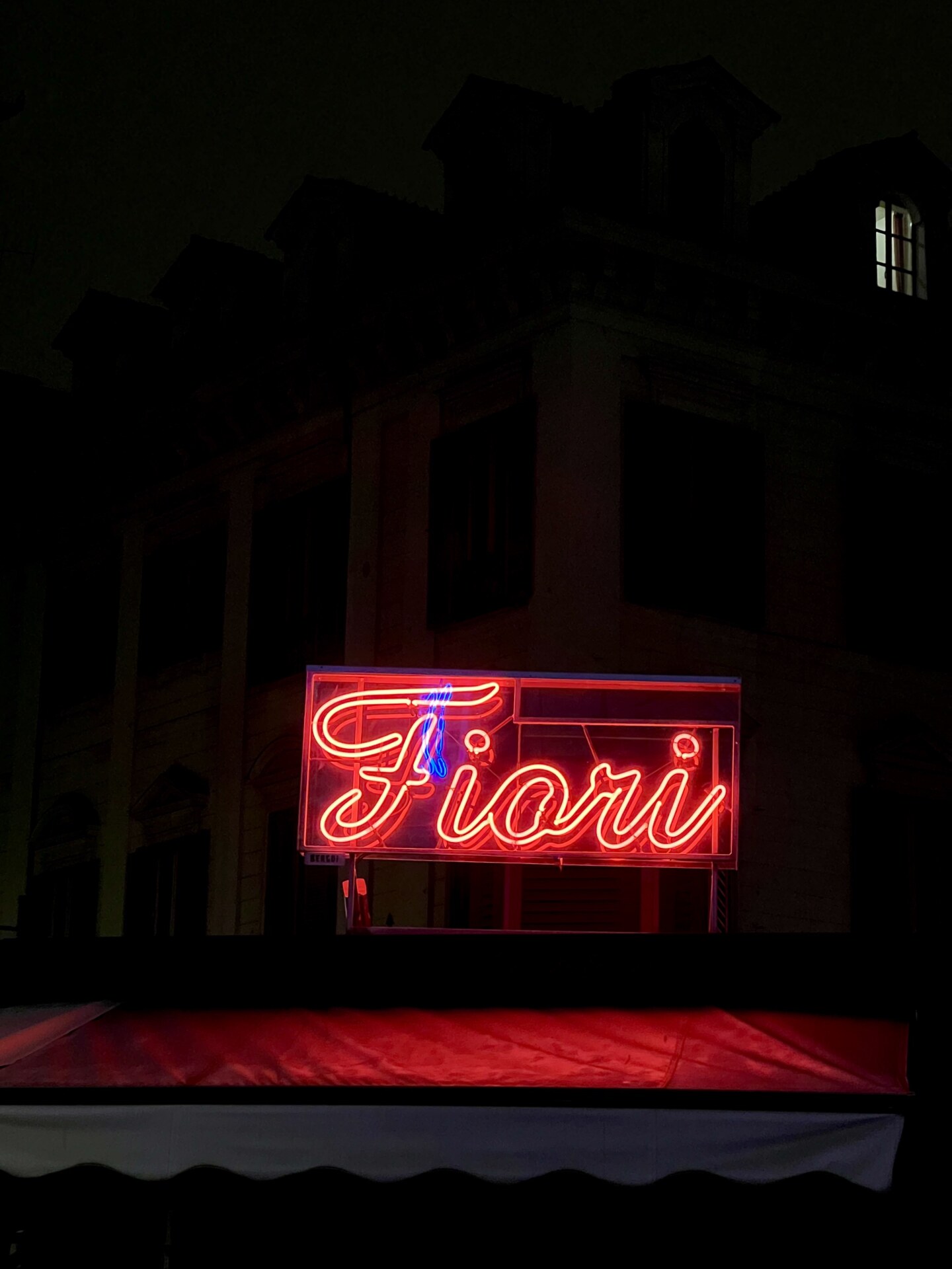 a red neon sign for fiori