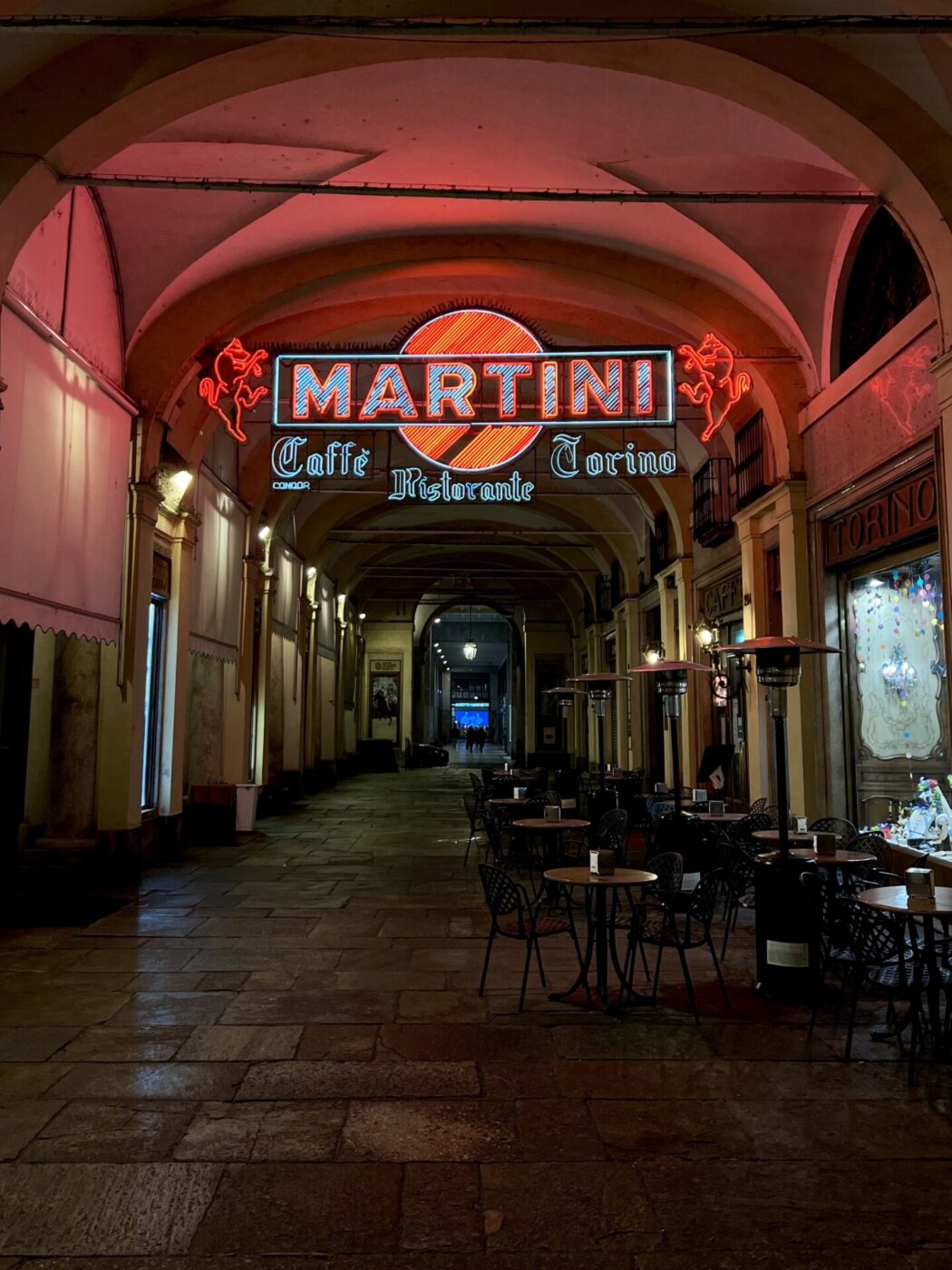 the caffe torino Martini sign in the portico in Turin