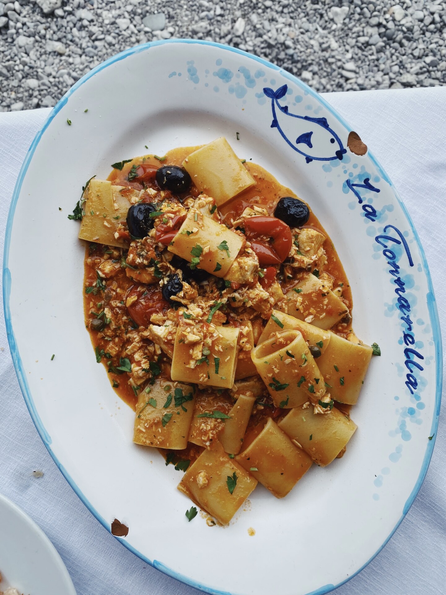 a dish of paccheri with a seafood tomato sauce