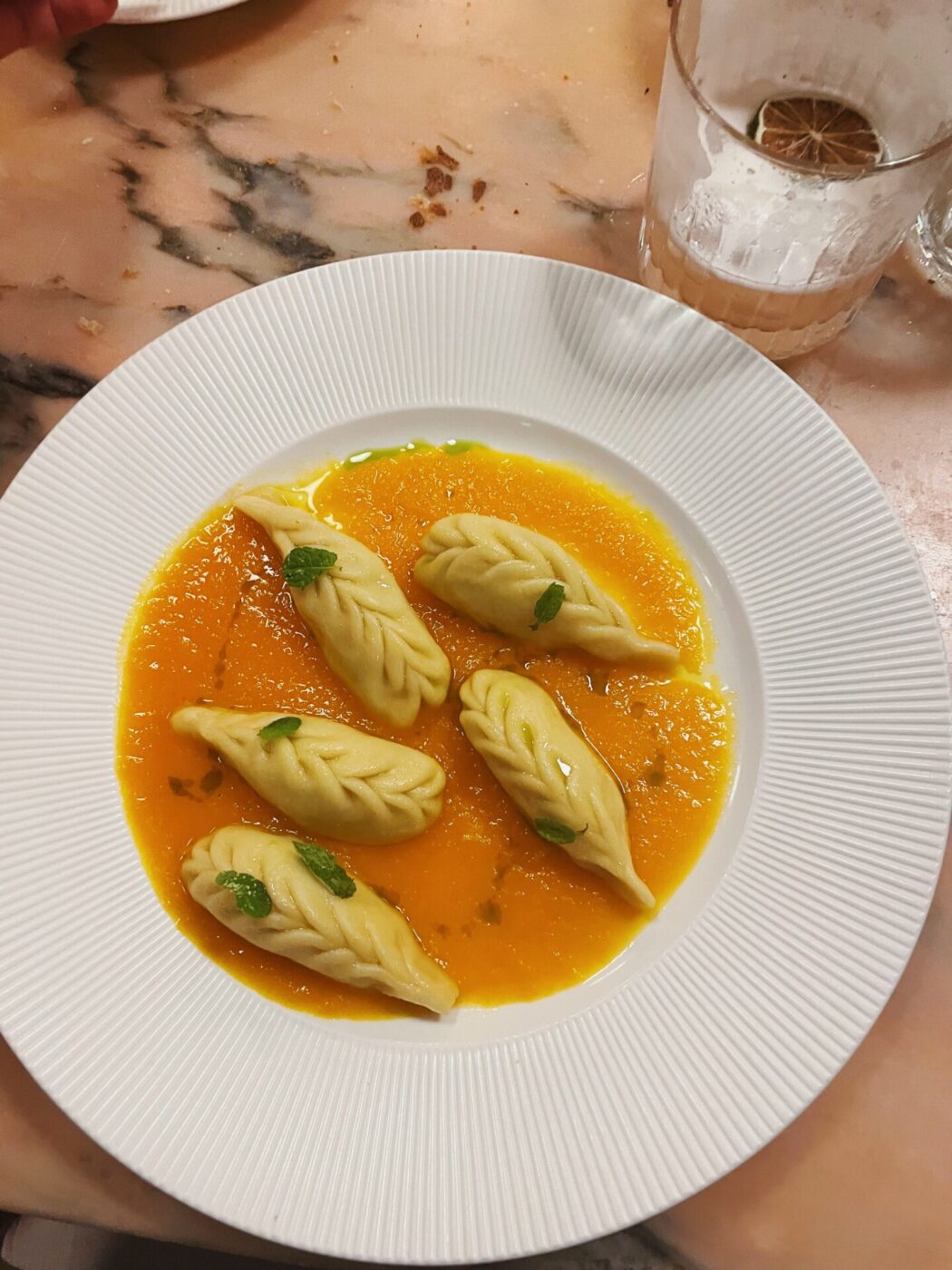 a bowl of Culurgiones in broth