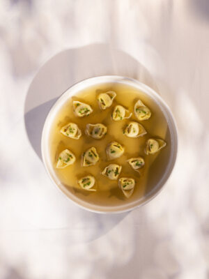 a bowl of tortellini in brodo
