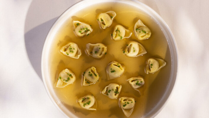 a bowl of tortellini in brodo