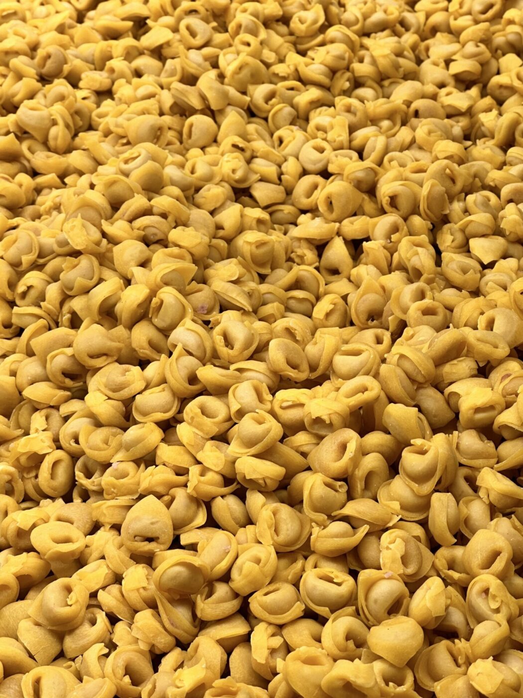 a huge pile of raw tortellini
