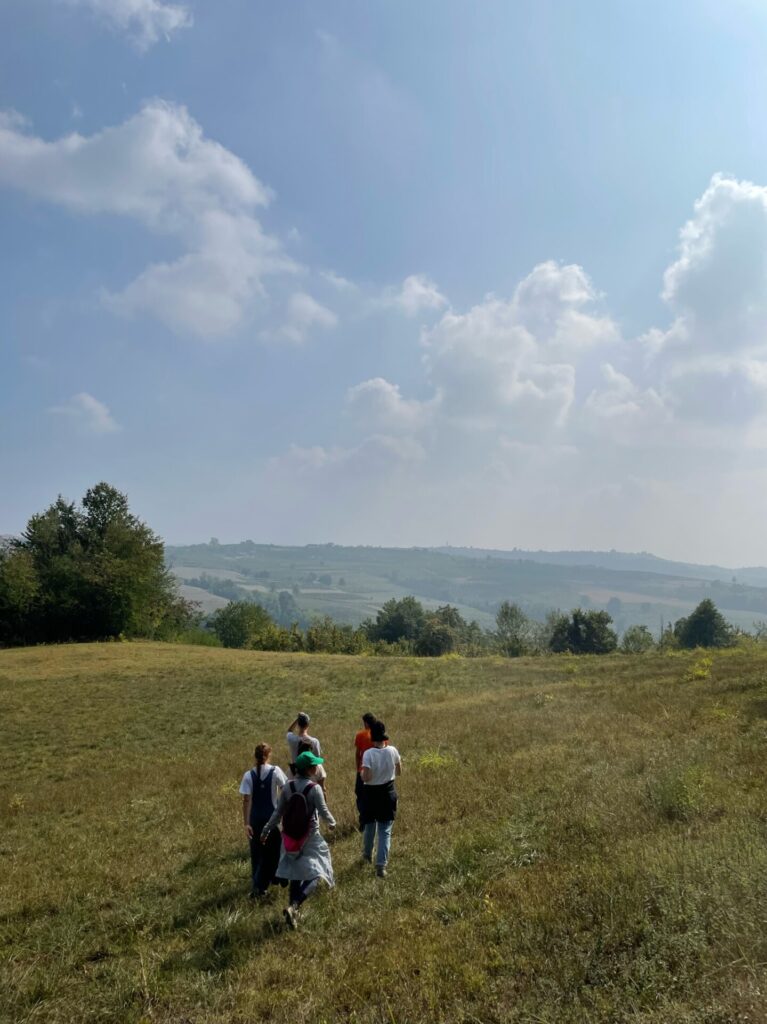 a few students walking through the hills at Casa Rotta