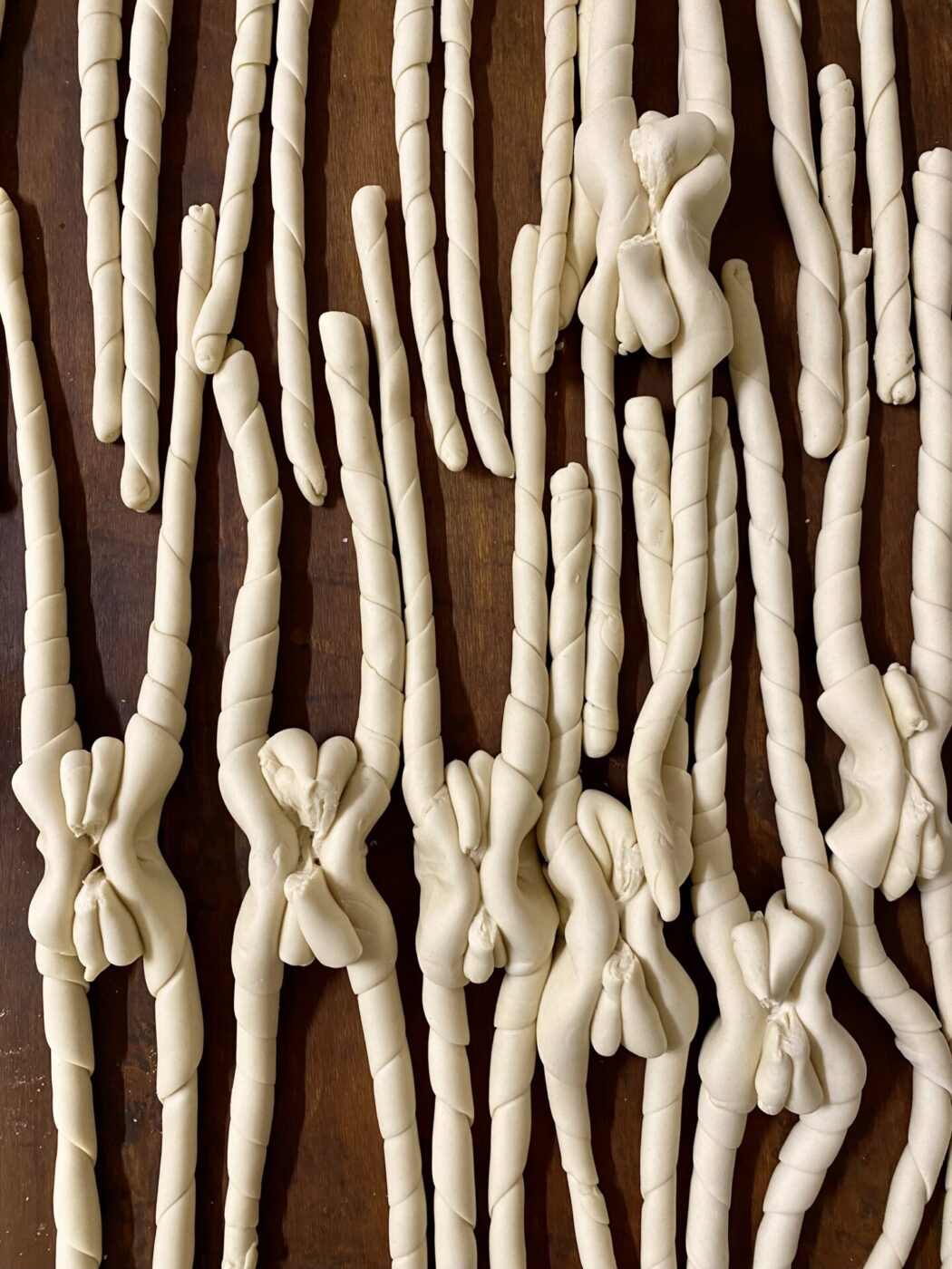 coppia ferrarese bread before it's baked, the twisted dough forming an X