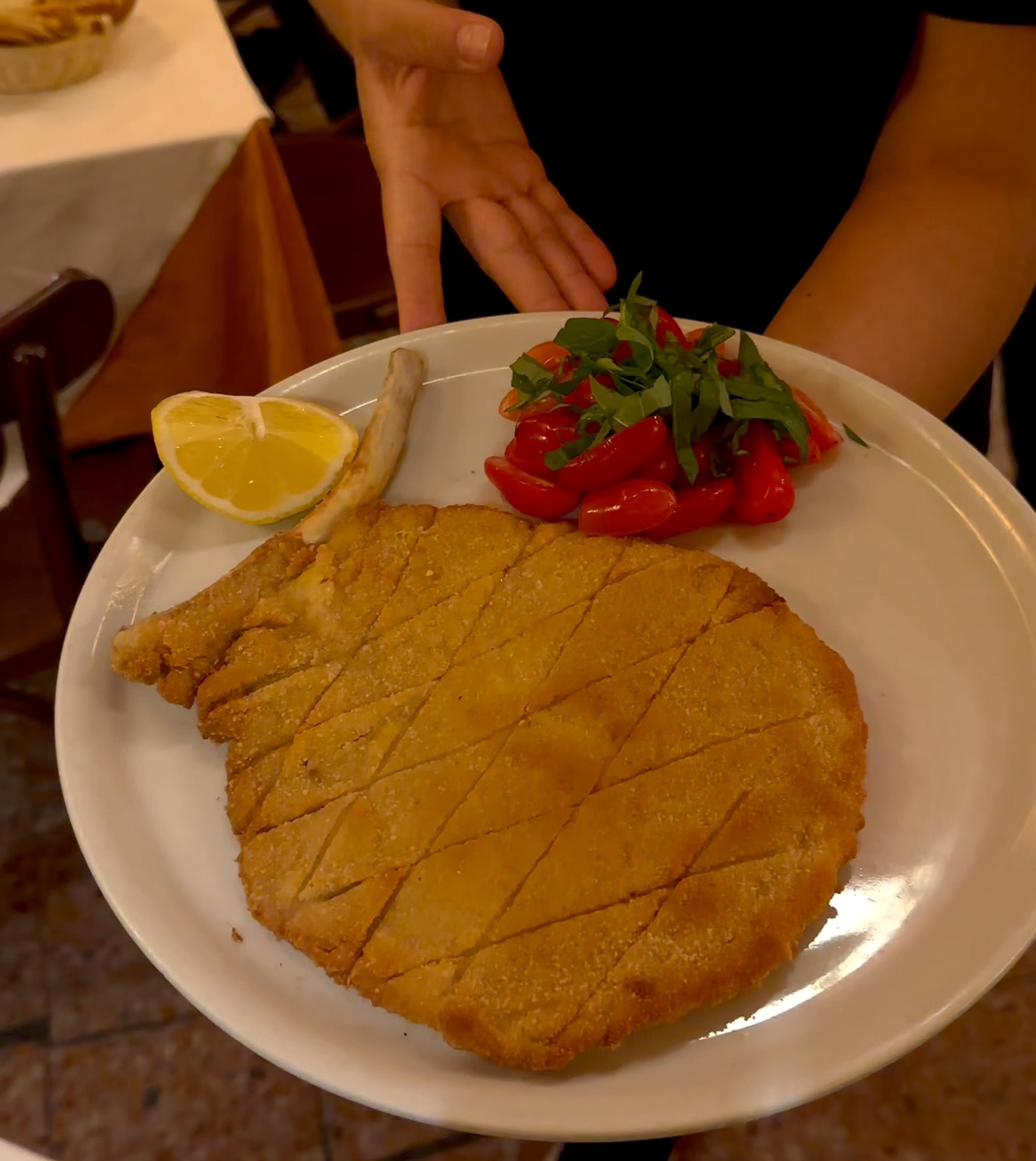 a plate of costoletta alla milanese