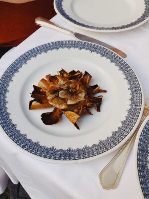 An image of fried carciofi alla giudia on a plate