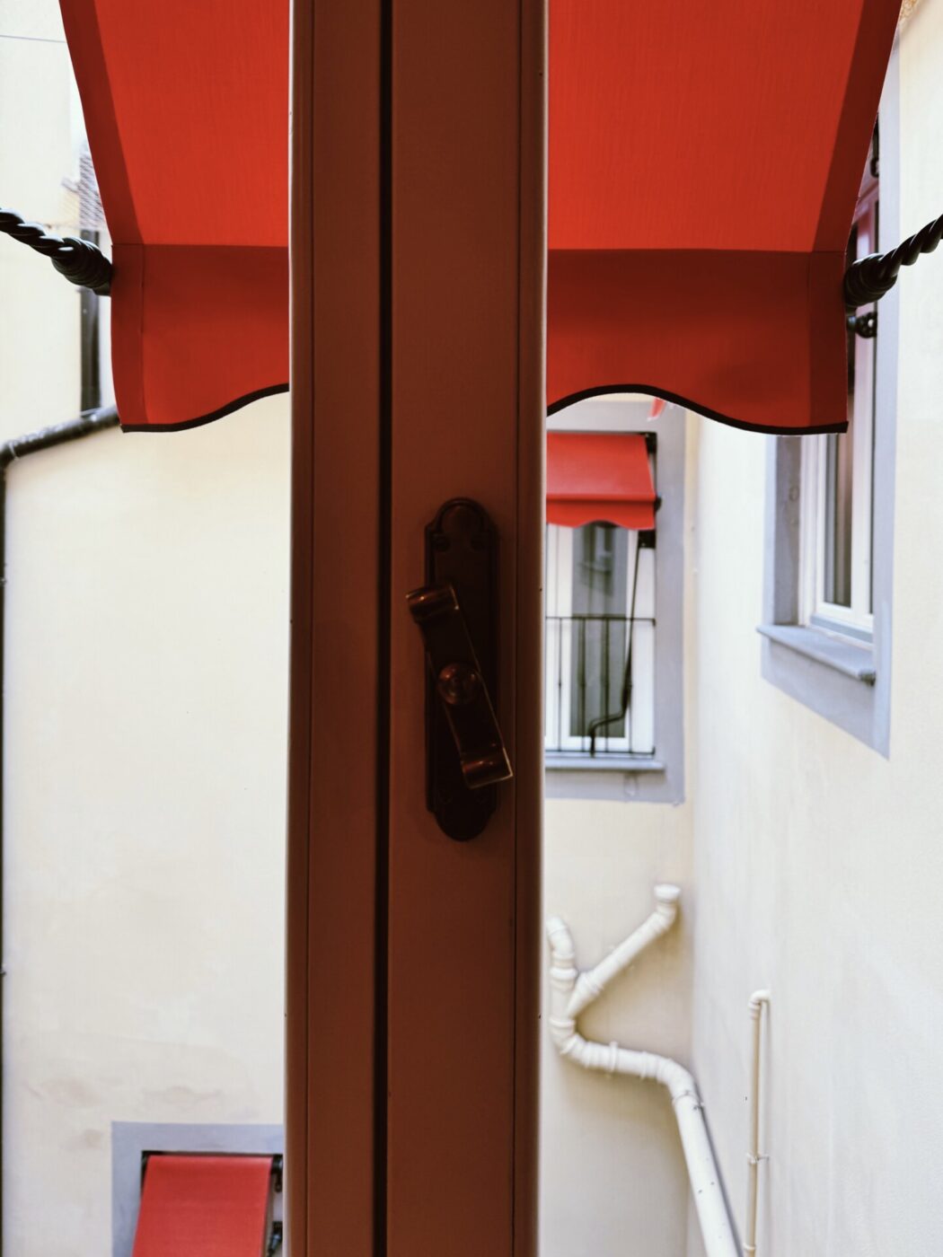 the balcony with a red awning at stella d'italia