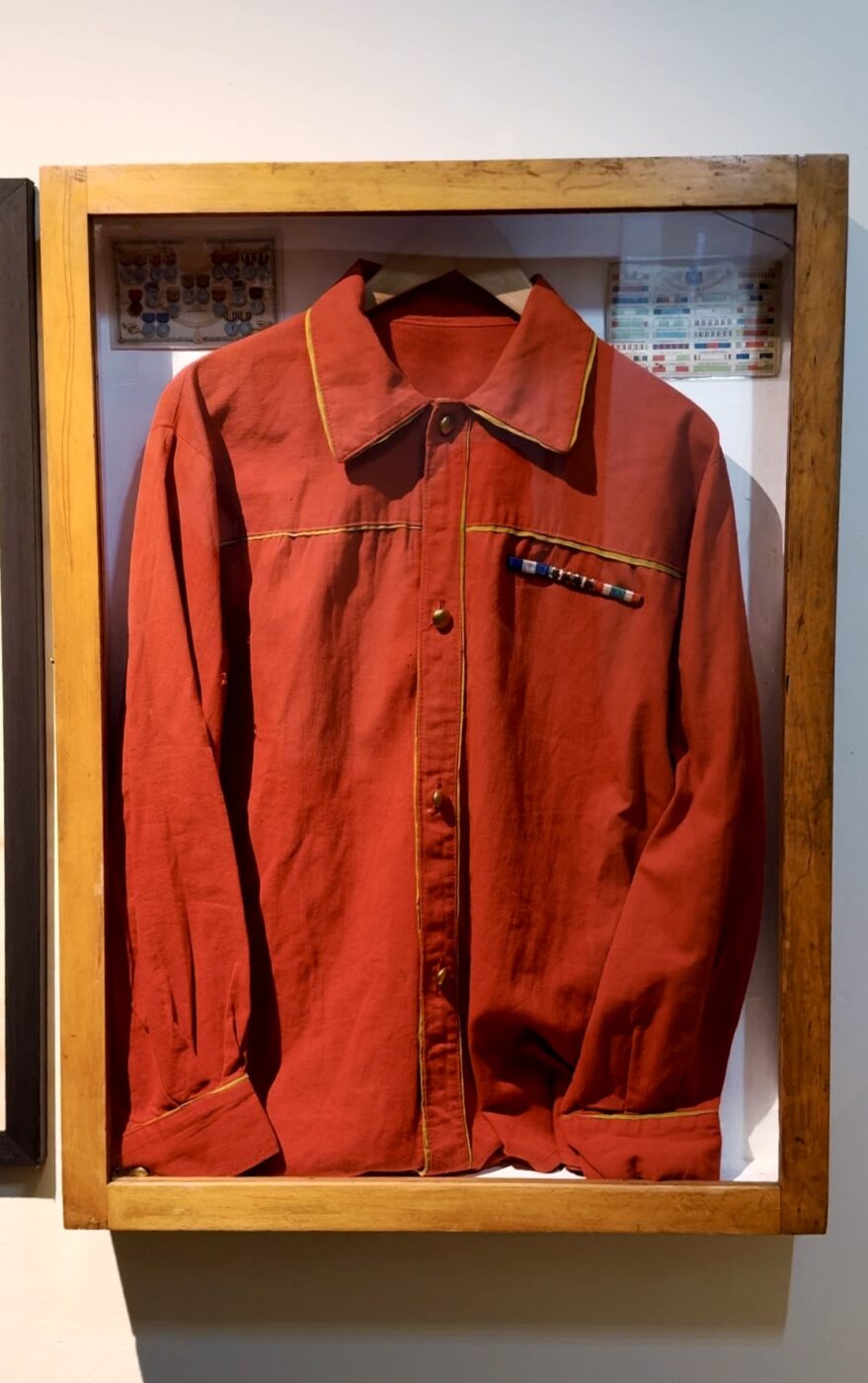 a red jacket hanging in one of the rooms at stella d'italia