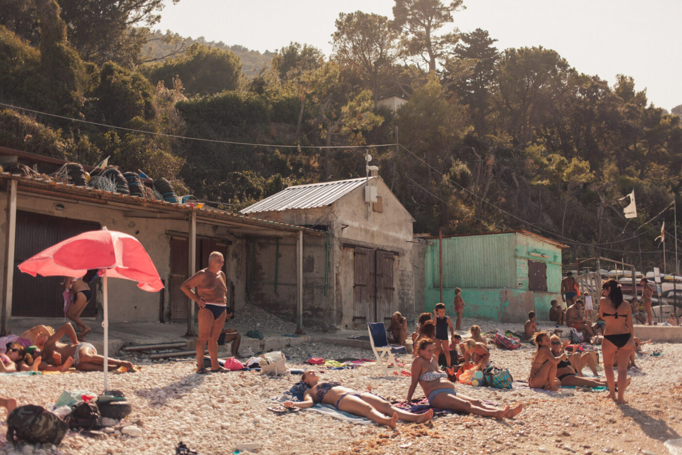 an image of people laying on the beach at the Riviera del Conero