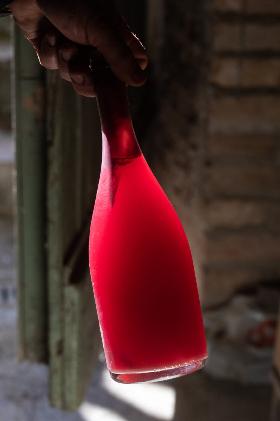 a bottle of bright red fiery wine from VUM