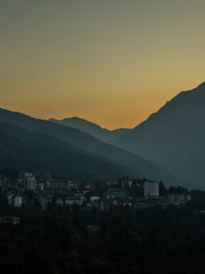 the beautiful colors of the autumn in the italian alps during sunset over Oulx