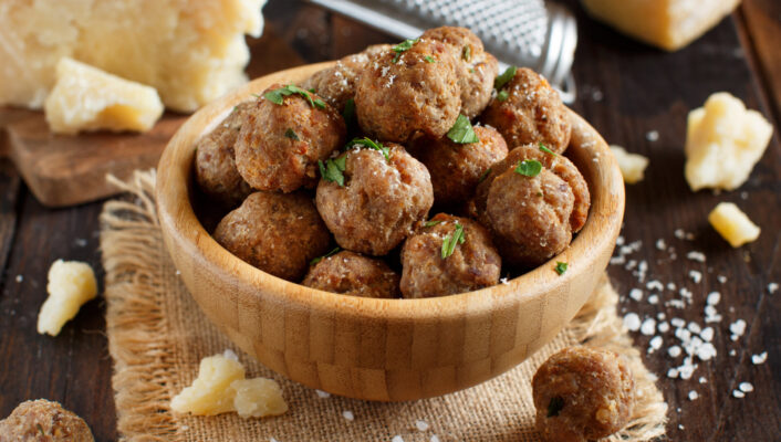 an image of a yellow bowl of Mondeghili–round milanese fried meat balls