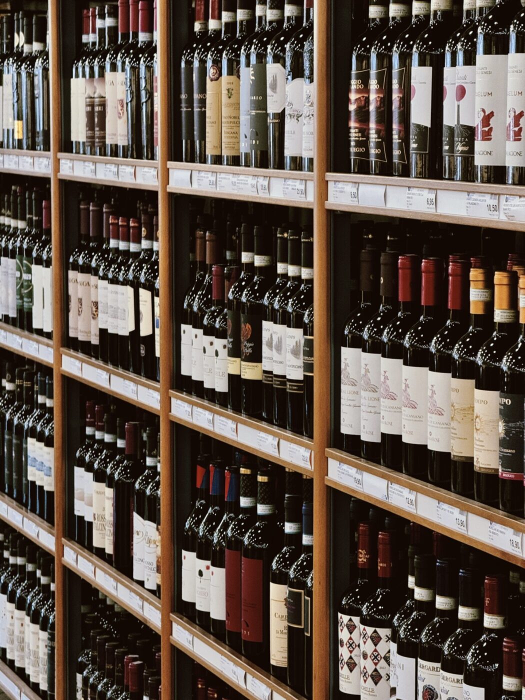 rows of wine for sale in a grocery store