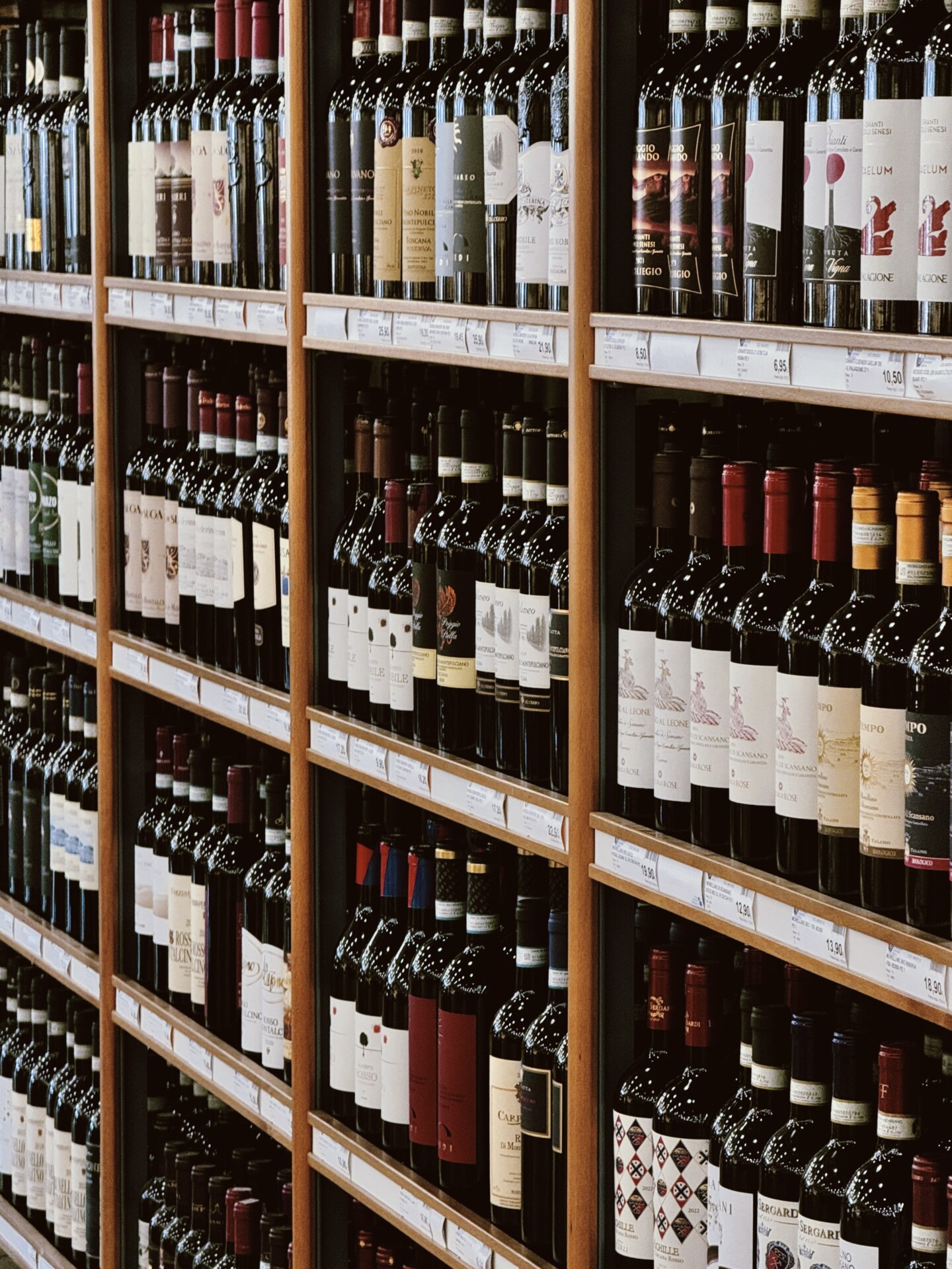 rows of wine for sale in a grocery store