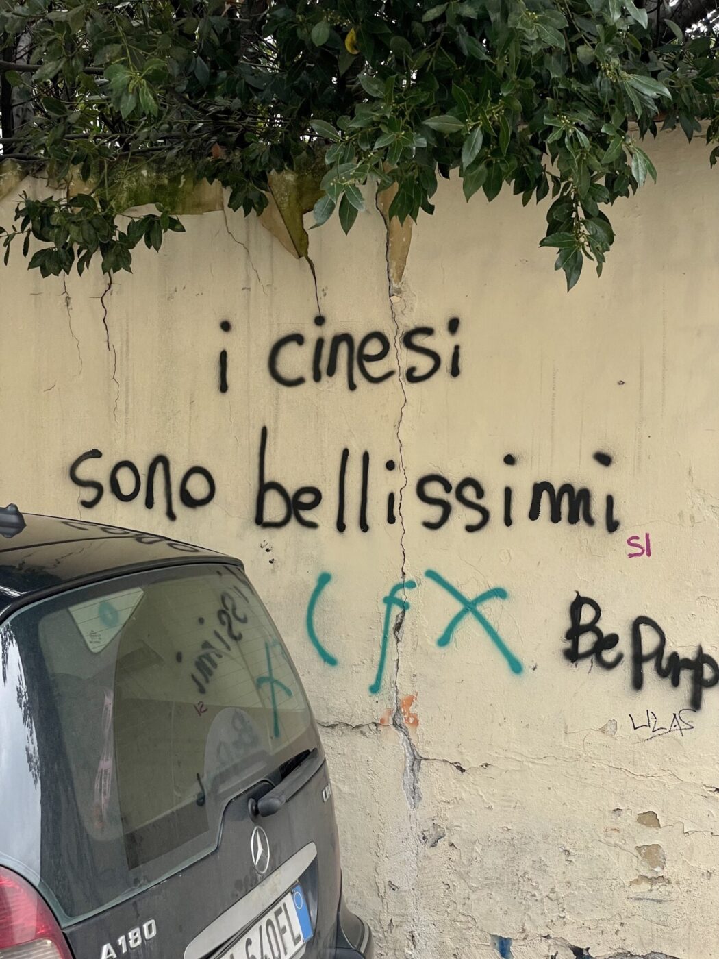 grafitti in prato reading "the chinese in prato are beautiful""