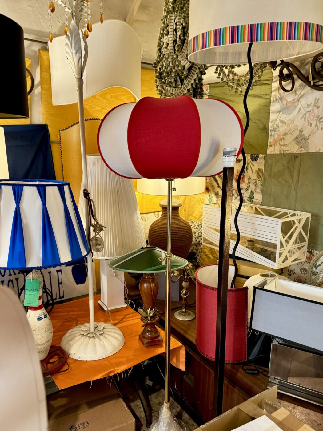 a bunch of brightly colored lampshades at PARALUMI-LAMPSHADES-LAR dal 1938