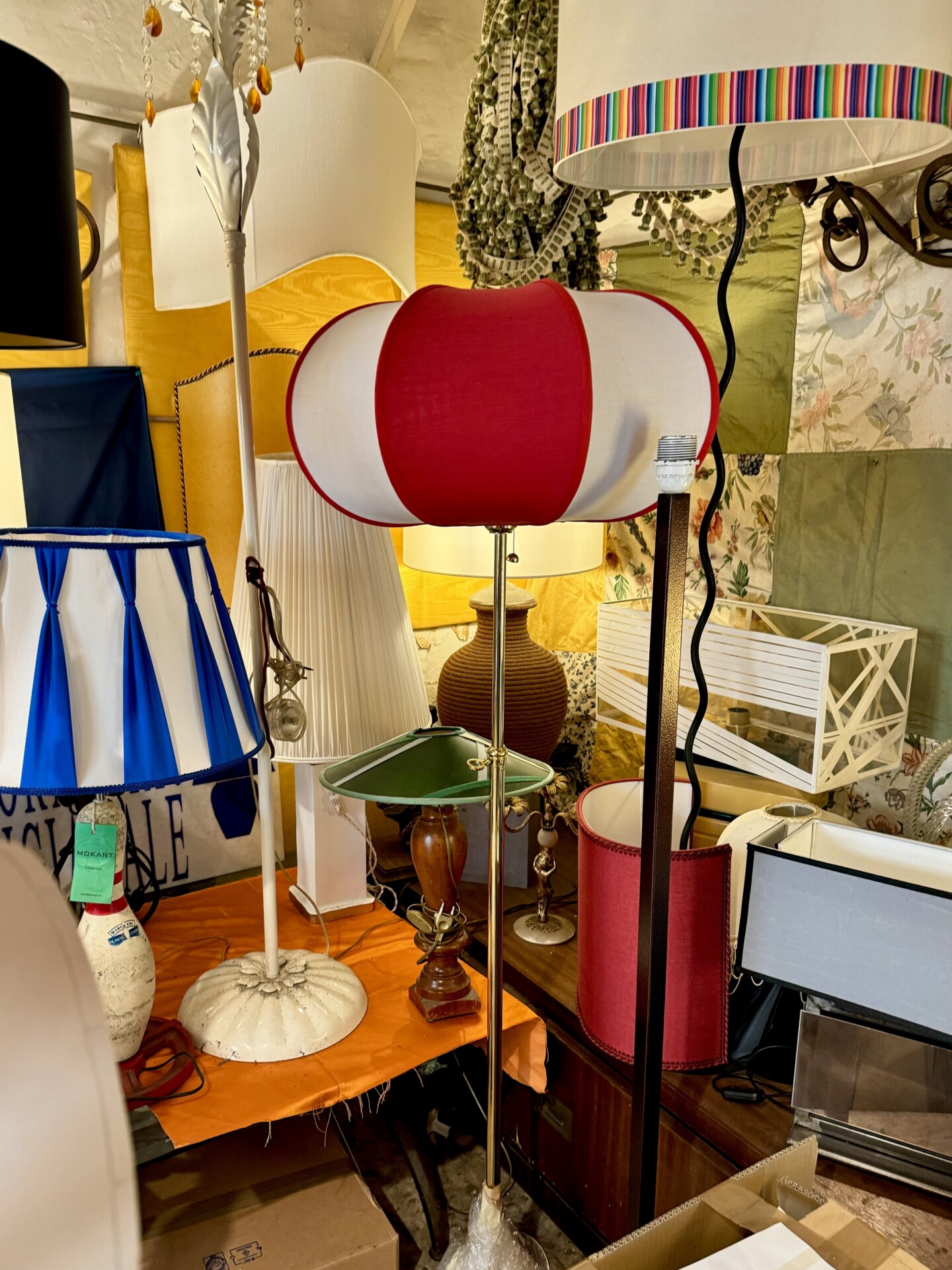 a bunch of brightly colored lampshades at PARALUMI-LAMPSHADES-LAR dal 1938