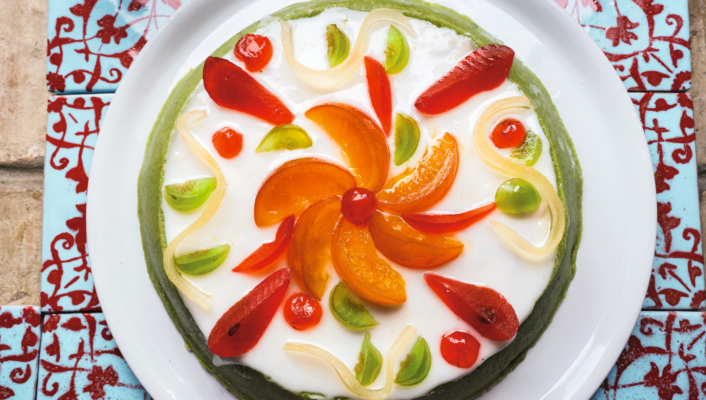 an overhead image of cassata cake arranged beautifully with candied fruit