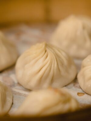 a photo of steamed dumplings in a basket