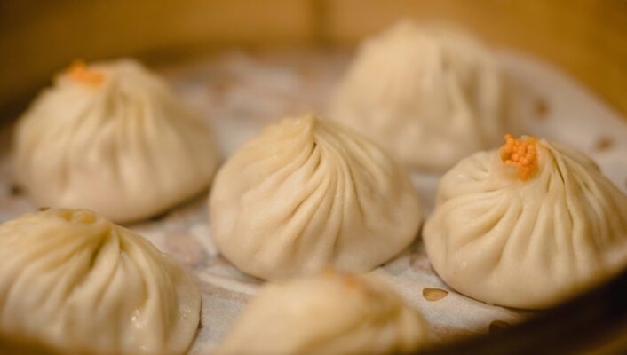 a photo of steamed dumplings in a basket