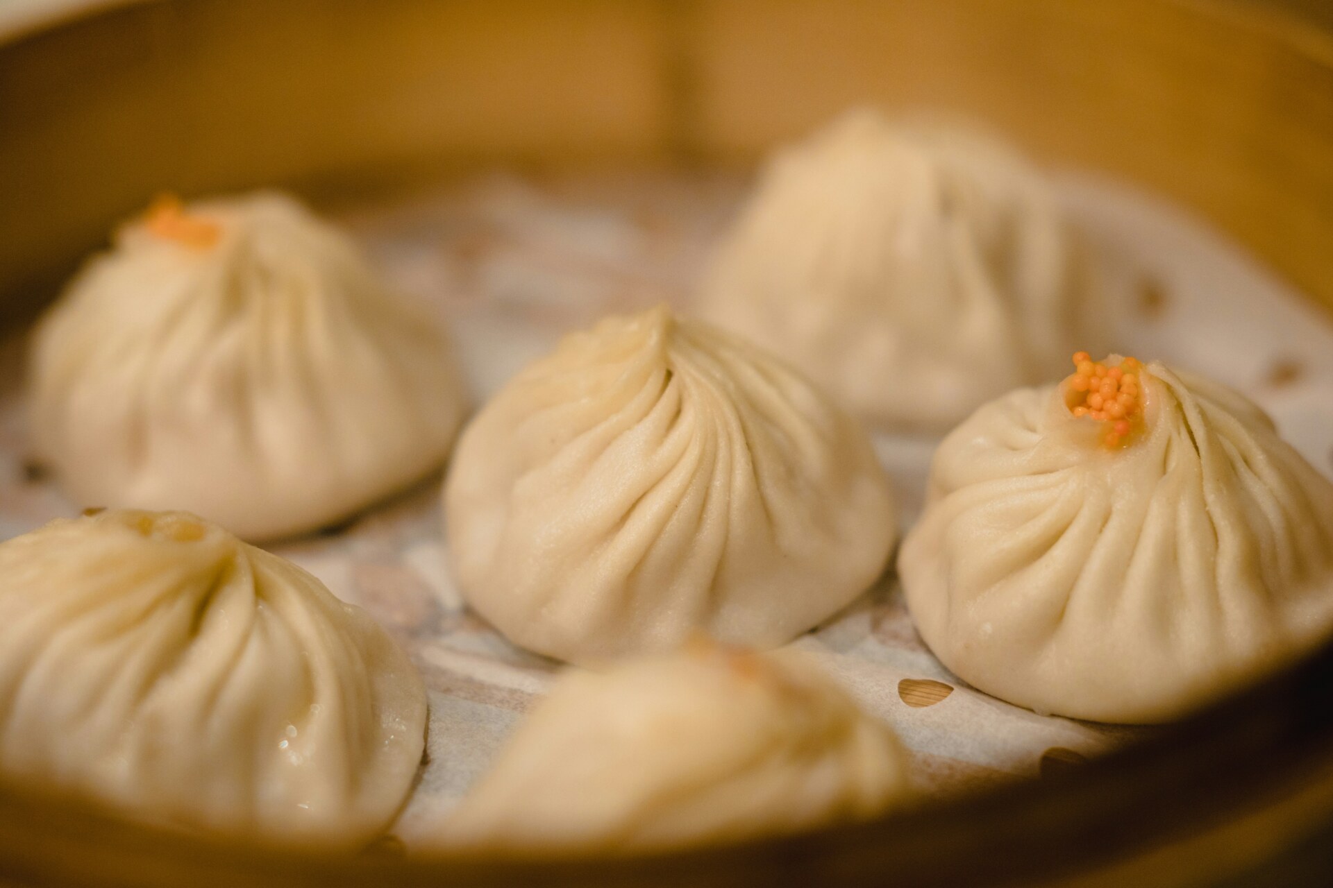 a photo of steamed dumplings in a basket