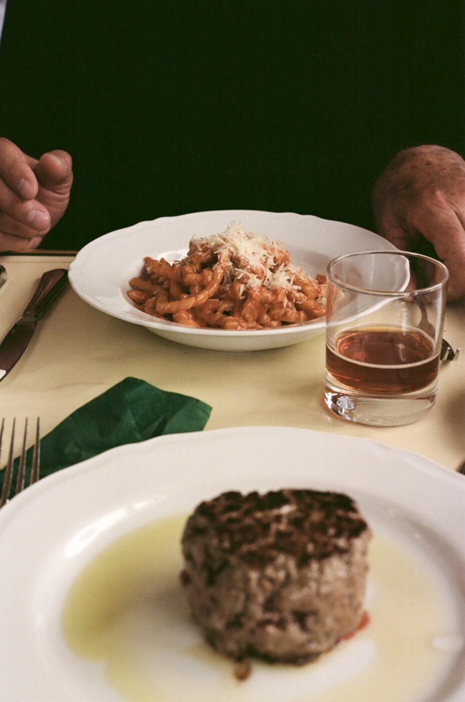 an image of a table with a dish of pasta and a plate of meat at Cibreo Caffe