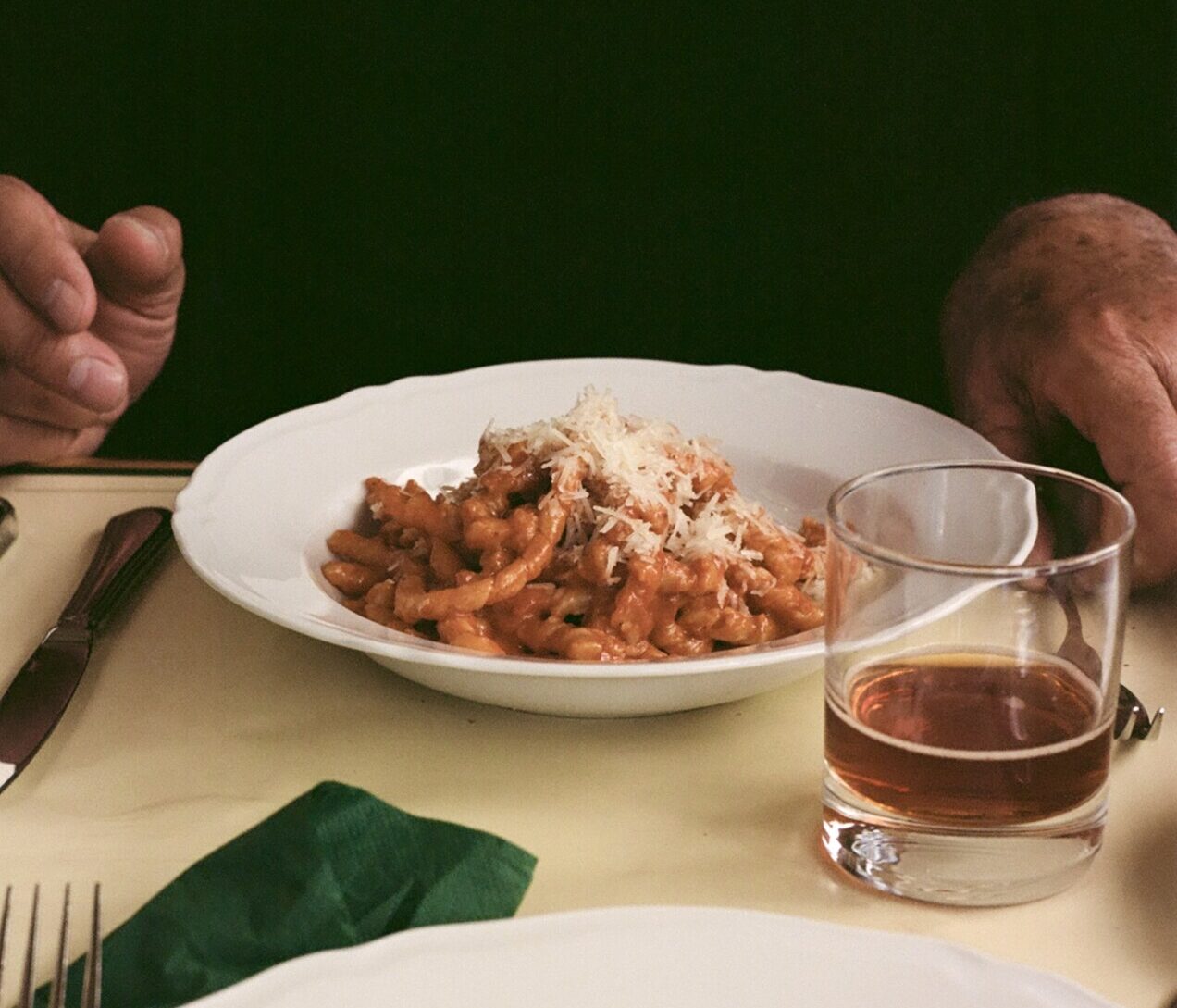 an image of a table with a dish of pasta and a plate of meat at Cibreo Caffe