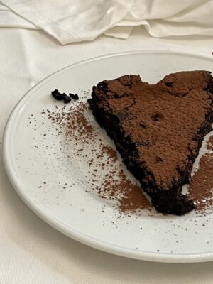 torta caprese, a thin slice of super chocolatey cake
