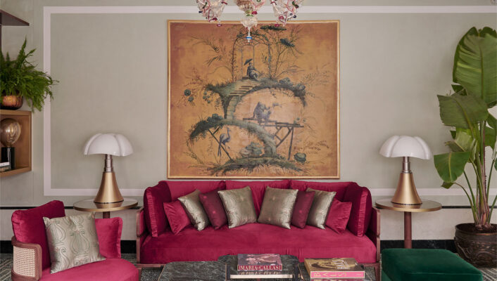 a bright red couch at violino d'oro