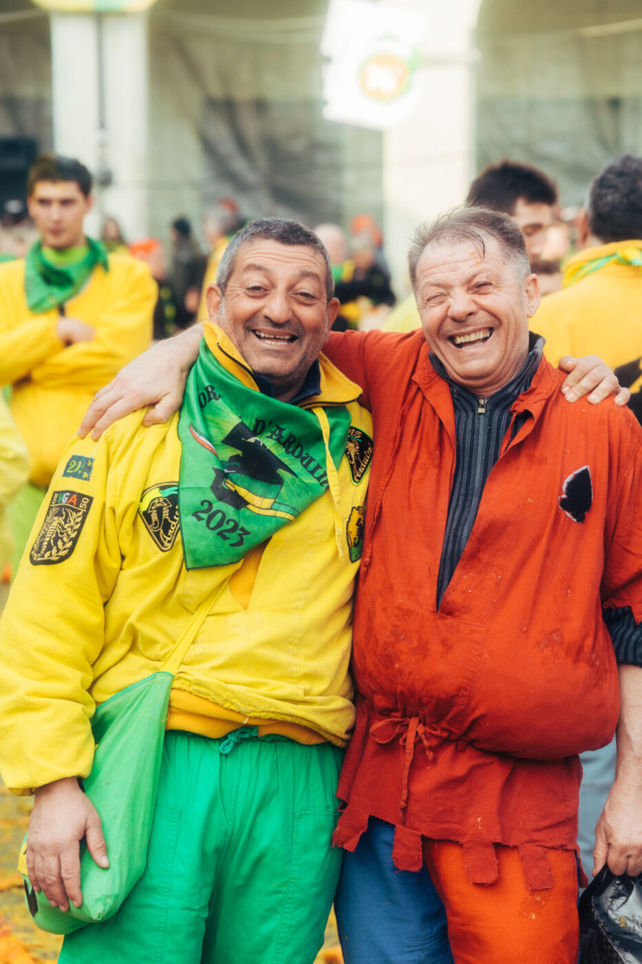 two old men on opposing teams wearing