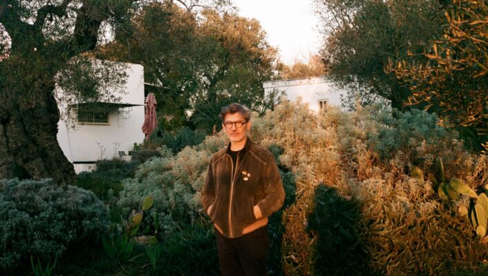 an image of Cosimo Terlizzi standing in the yard by his house in Puglia at golden hour