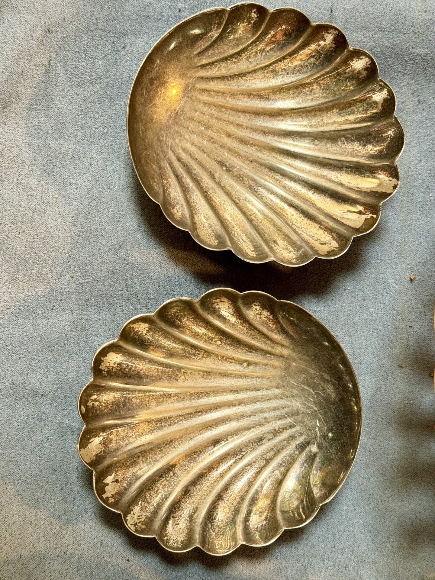 an image of two brass shells taken from above from a vintage market