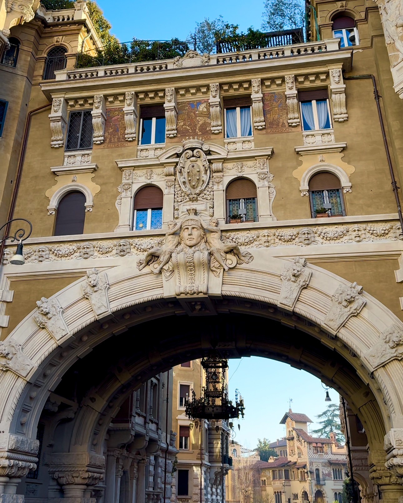 an image of a two-story bridge apartment over the road with funky designs