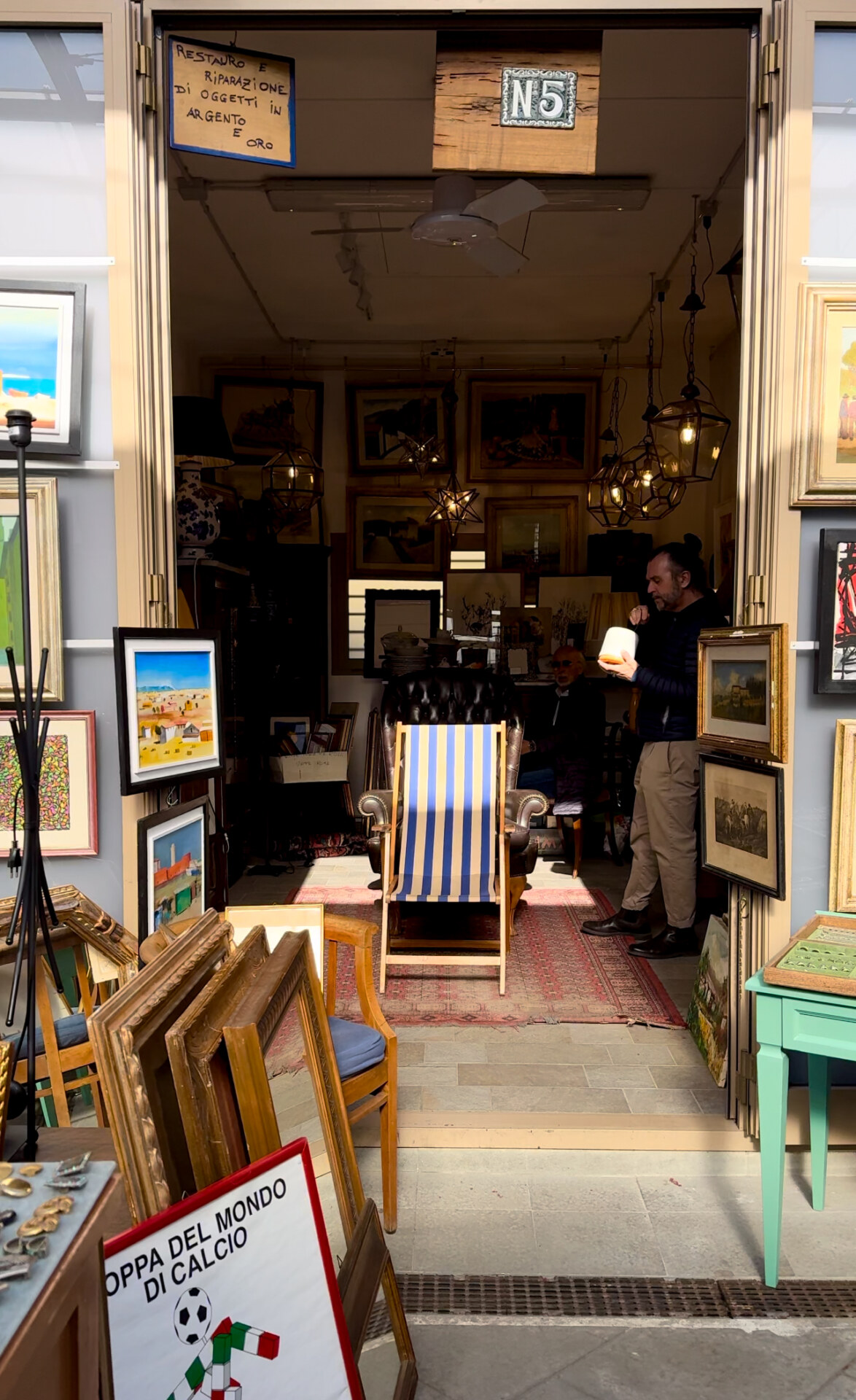 an image of vintage frames in a stand in the Pulci market in Florence
