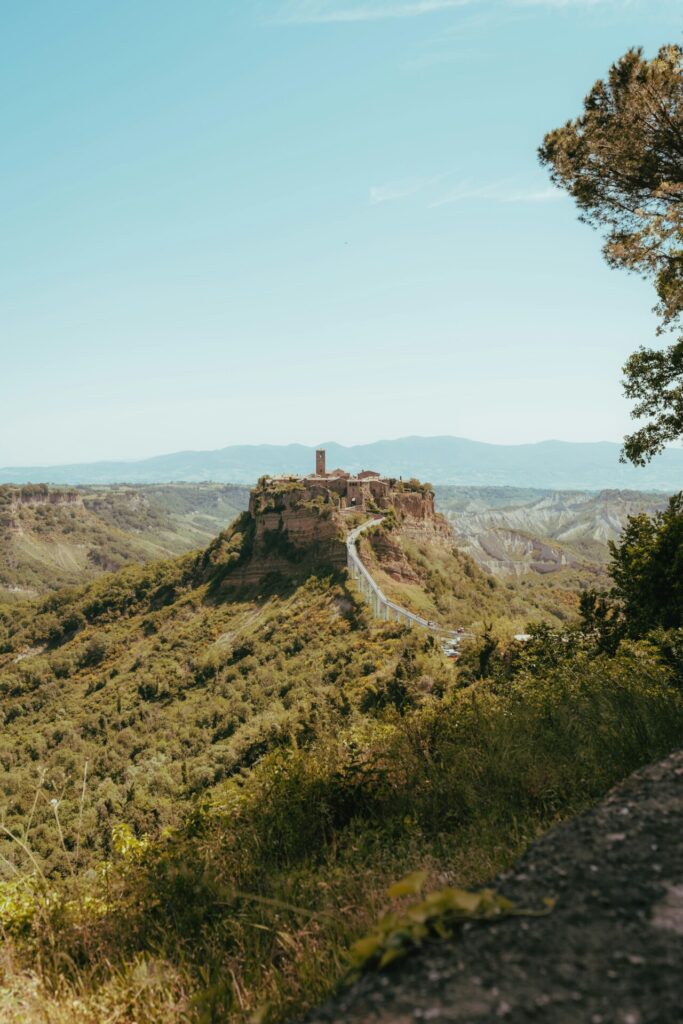 an image from afar of Civita di Bagnoregio, the city located up on a hilltop in Viterbo
