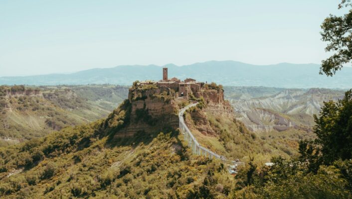 an image from afar of Civita di Bagnoregio, the city located up on a hilltop in Viterbo