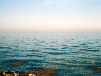 a film photo of sunset over the turquoise waters of Puglia