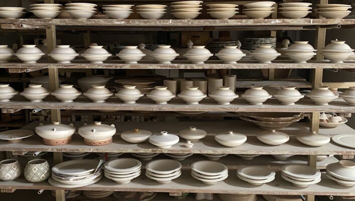 Francesco Fasano's studio in Grottaglie with shelves stacked with ceramics
