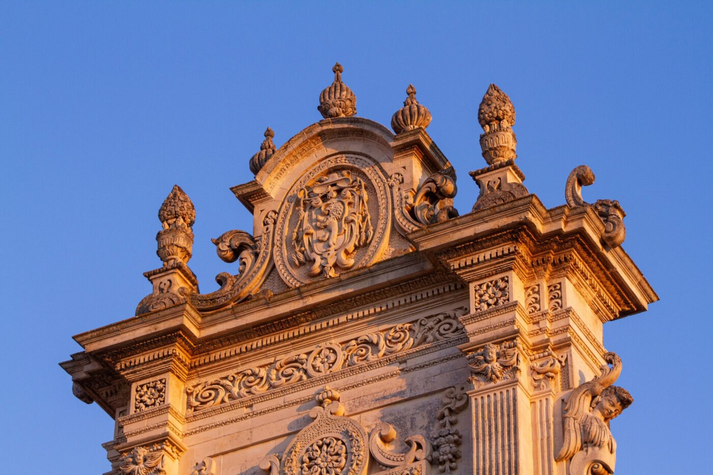 an image of the detailing of the facade of a baroque church in Lecce