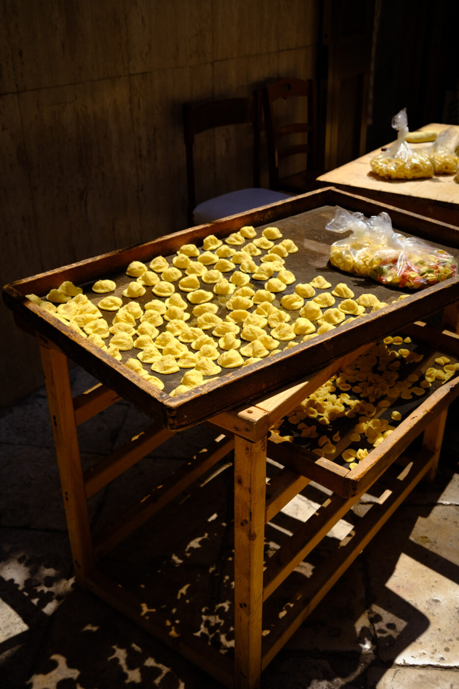 an image of a tray filled with freshly made orecchiette