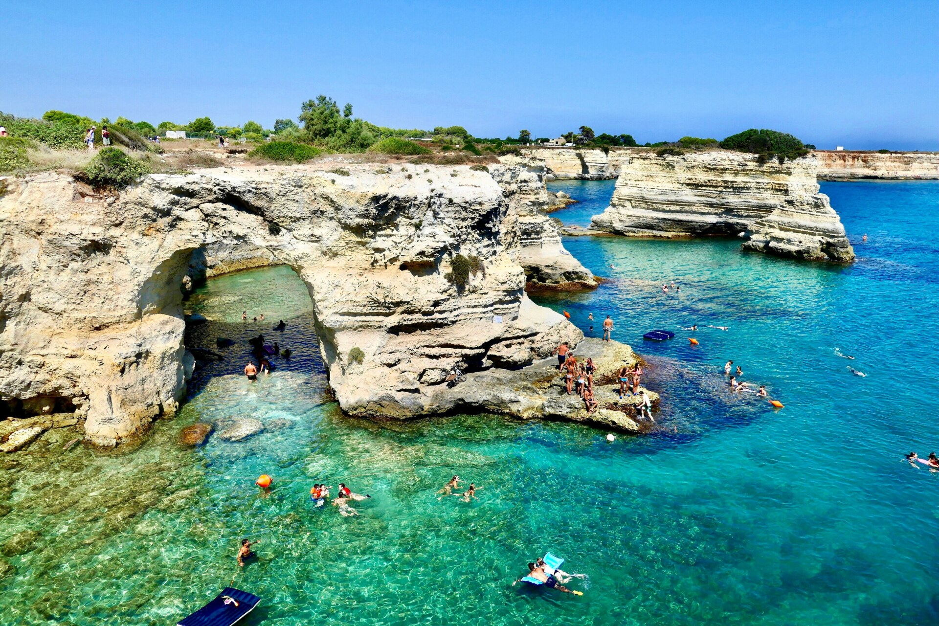 rocky outcrops in the clear blue and green waters of Oltranto