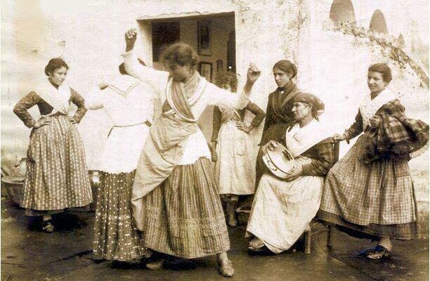 a vintage image of women dancing the tarantella
