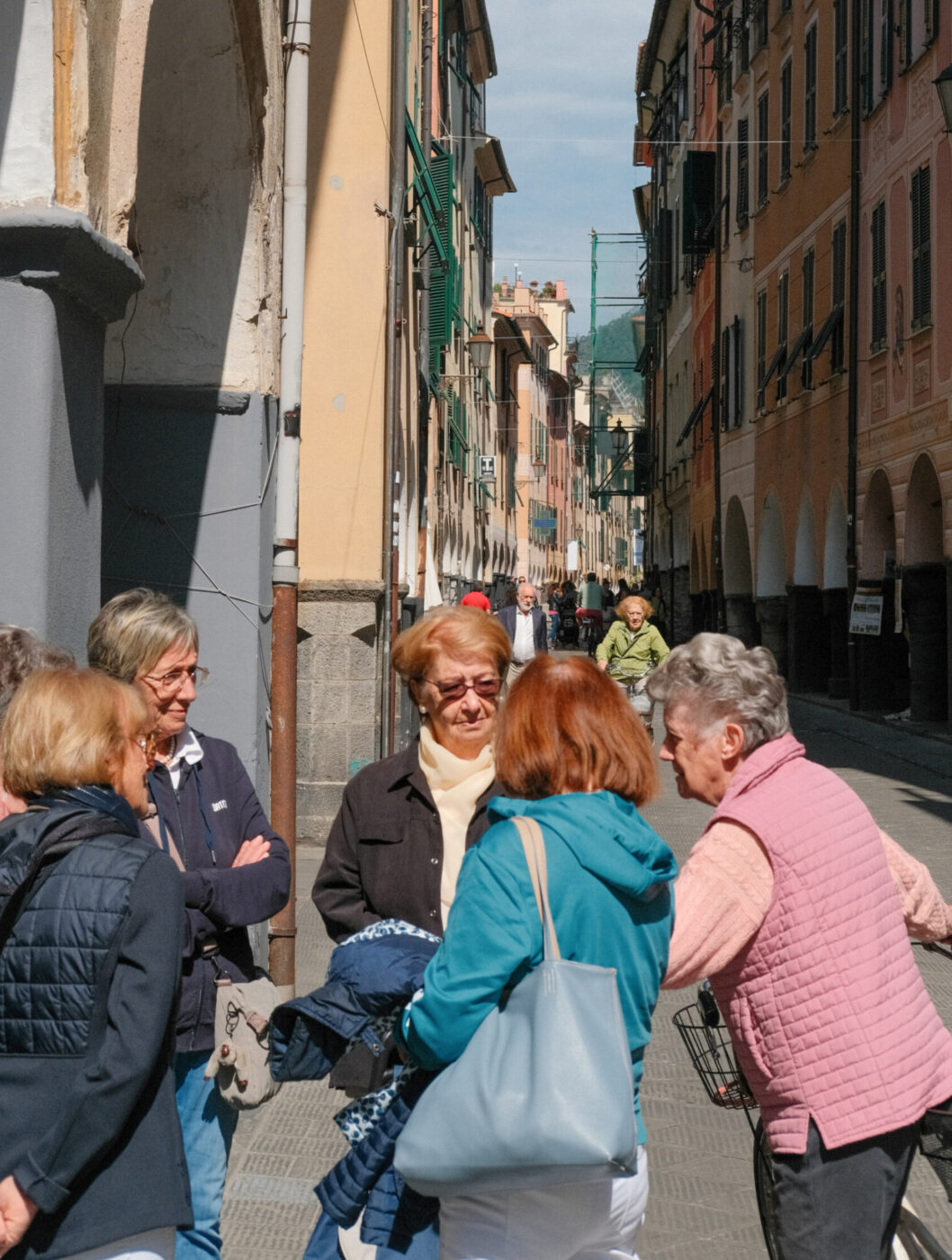 an image of a group of women standing and talking in the streets of Chiavari
