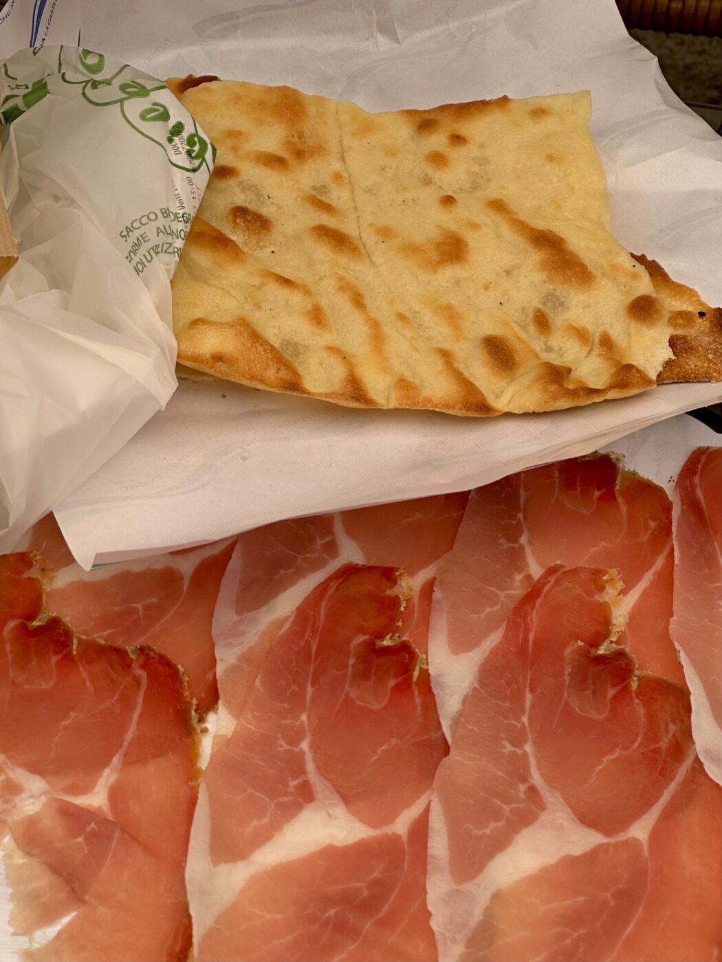 an image of thin carasau bread with prosciutto