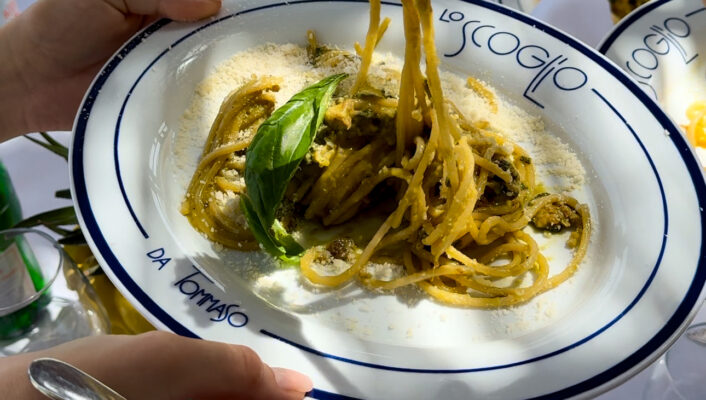 an image of someone taking a forkful of spaghetti alla nerano