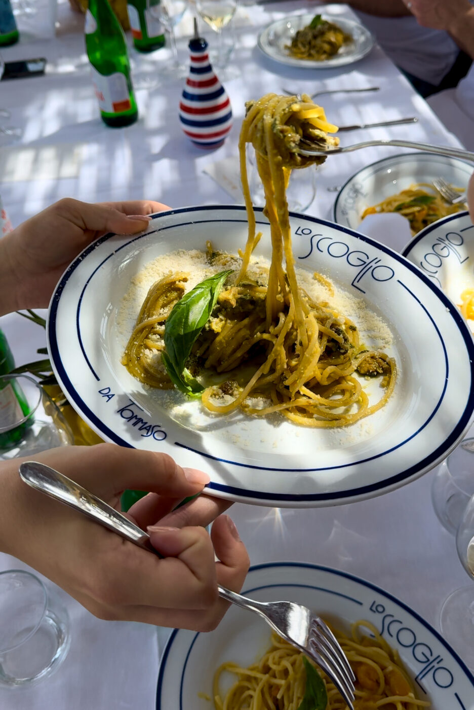 an image of someone taking a forkful of spaghetti alla nerano