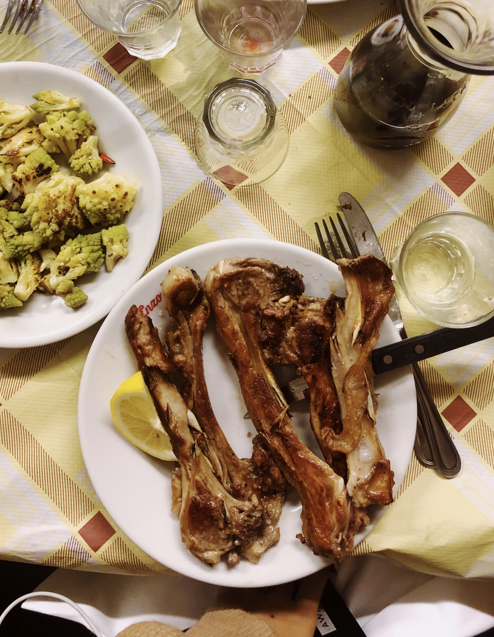 an overhead image of lamb chops at a restaurant in Rome