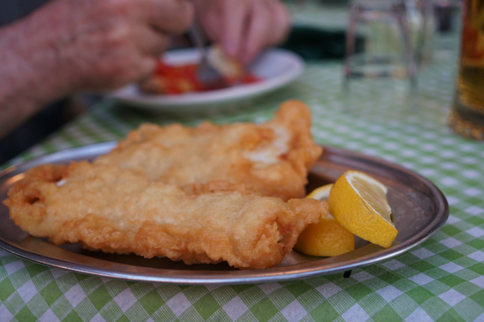 an image of fried cod filets on a silver platter