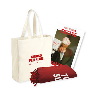 Estate Italiana Red Bundle - The Estate Italiana Red Bundle features a white tote bag with red text, a rolled-up red towel, and a magazine showing a hand holding an ice cream cone, all arranged against a white background.